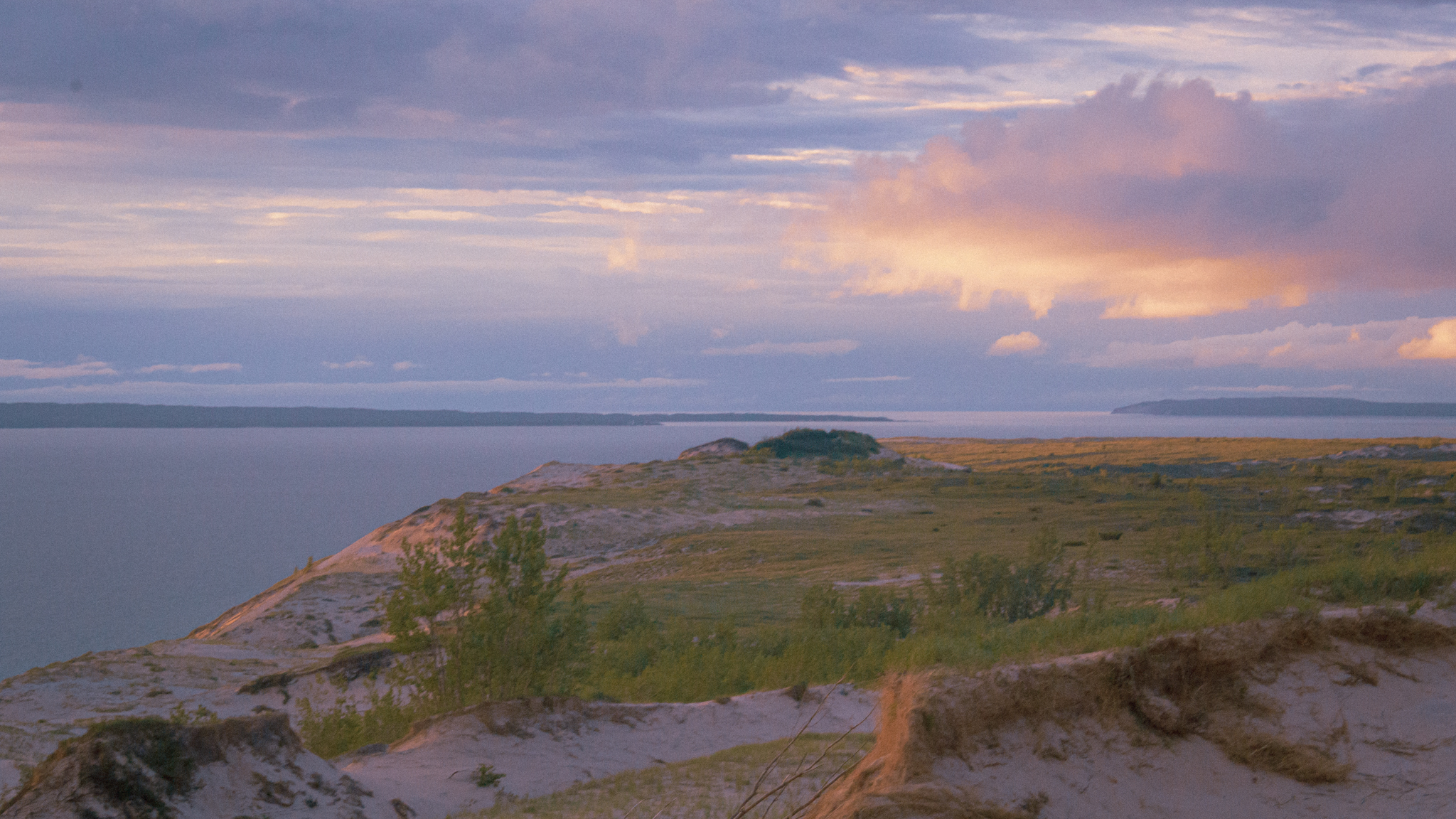 sunset over the sleeping bear dunes on a michigan hiking trail