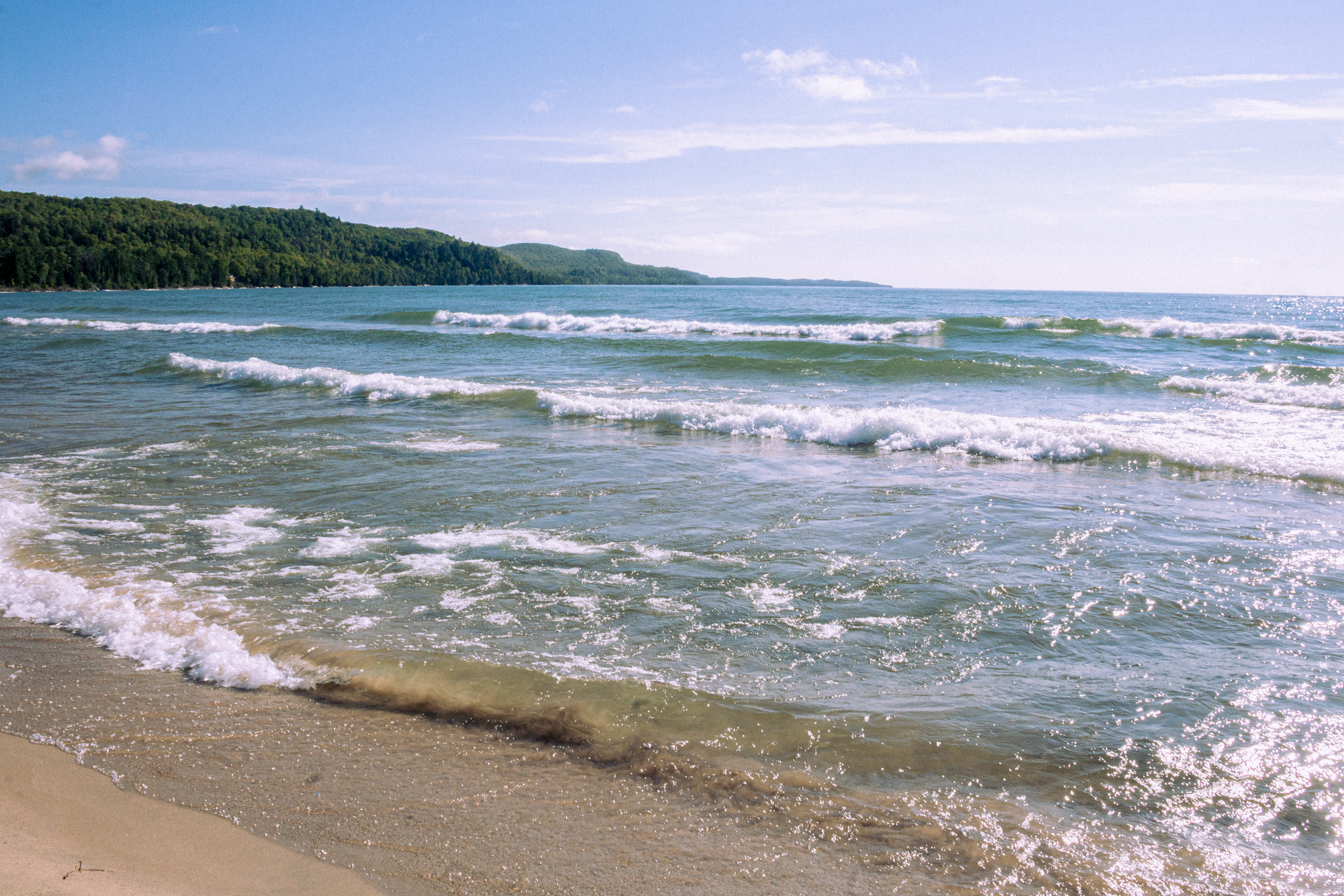 Image of crystal clear waves crashing into the sandy Bete Gris Beach in the Keewanaw Peninsula of Michigan on Lake Superior