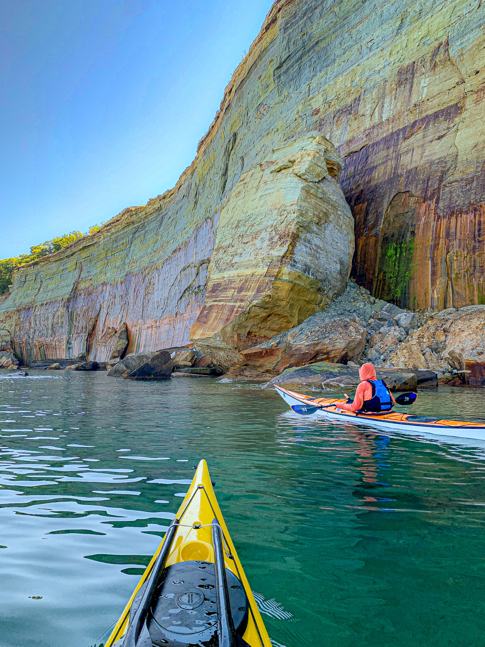 kayakers addle the pictured rocks cliffs