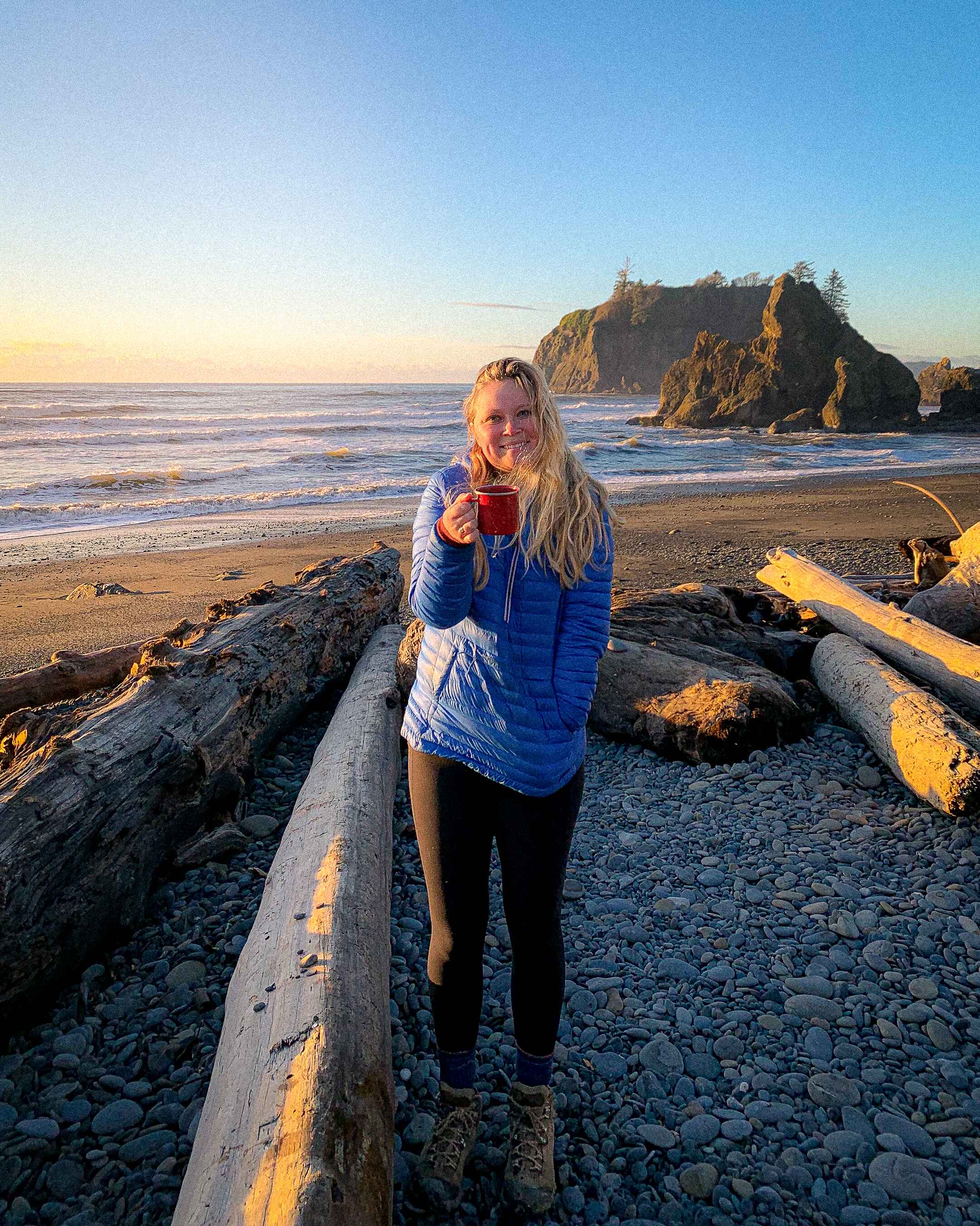 A hiker stands on Ruby beach in Washington's Olympic Peninsula
