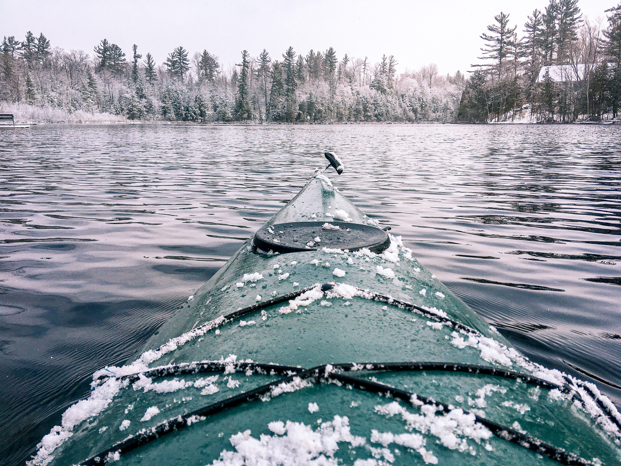 Image of winter kayaking in the snow on a lake in Northern Michigan