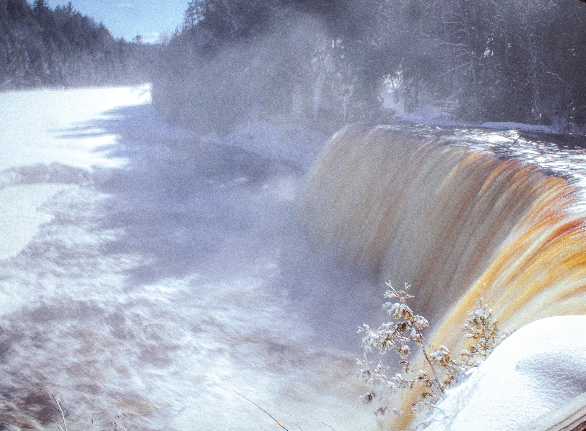 Tahquamenon Falls State Park in the winter, upper falls covered in ice