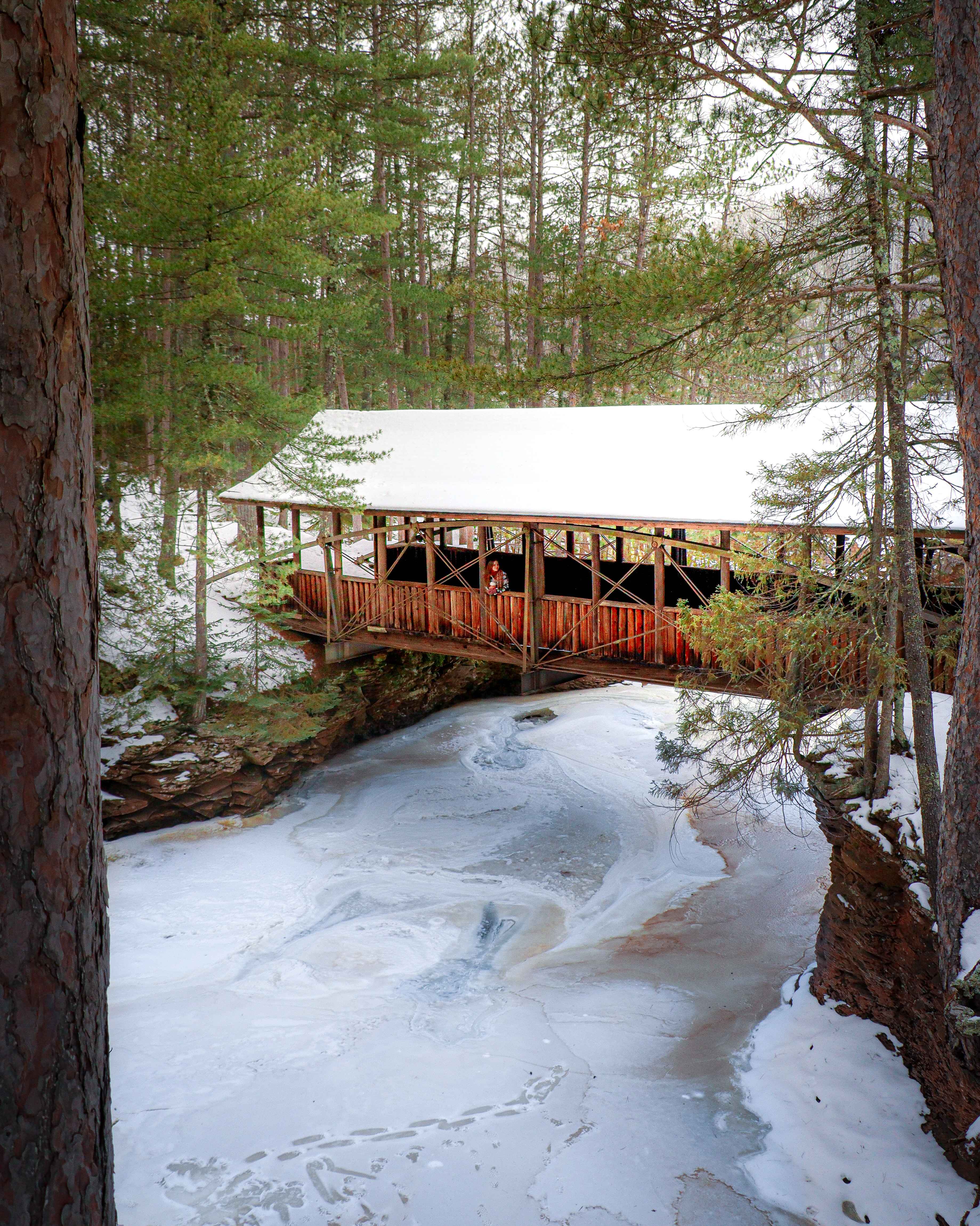 hiking amnicon falls state park in the winter near bayfield, wisconsin