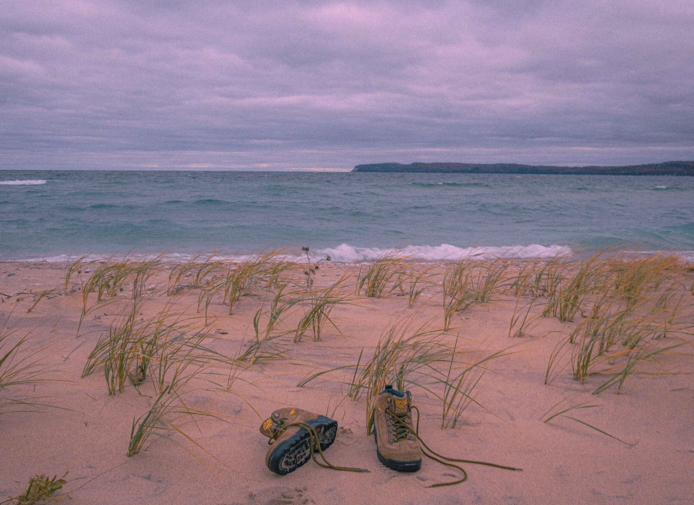hiking boots on a beach in the sleeping bear dunes