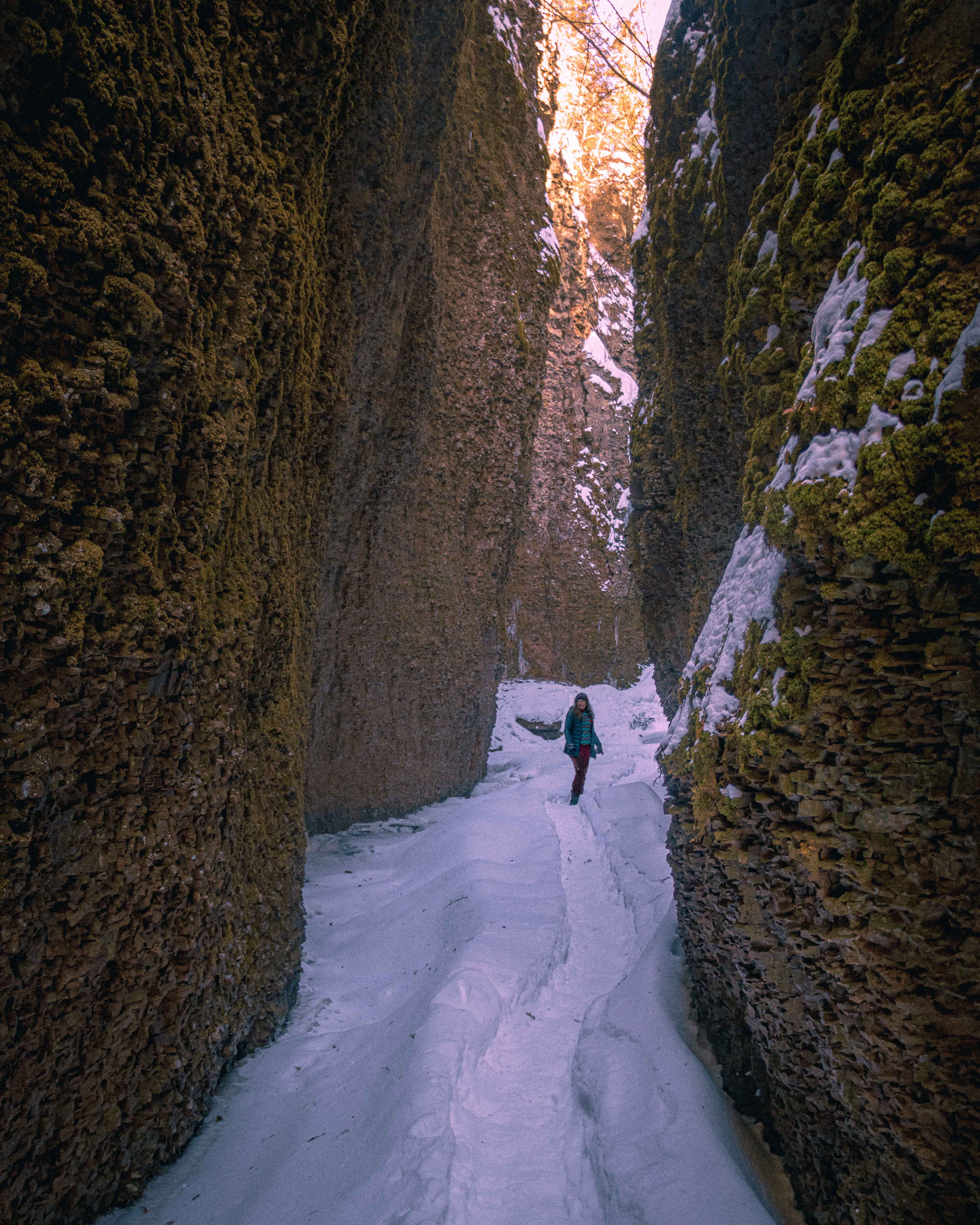 image of a winter hiker deep in a slot canyon