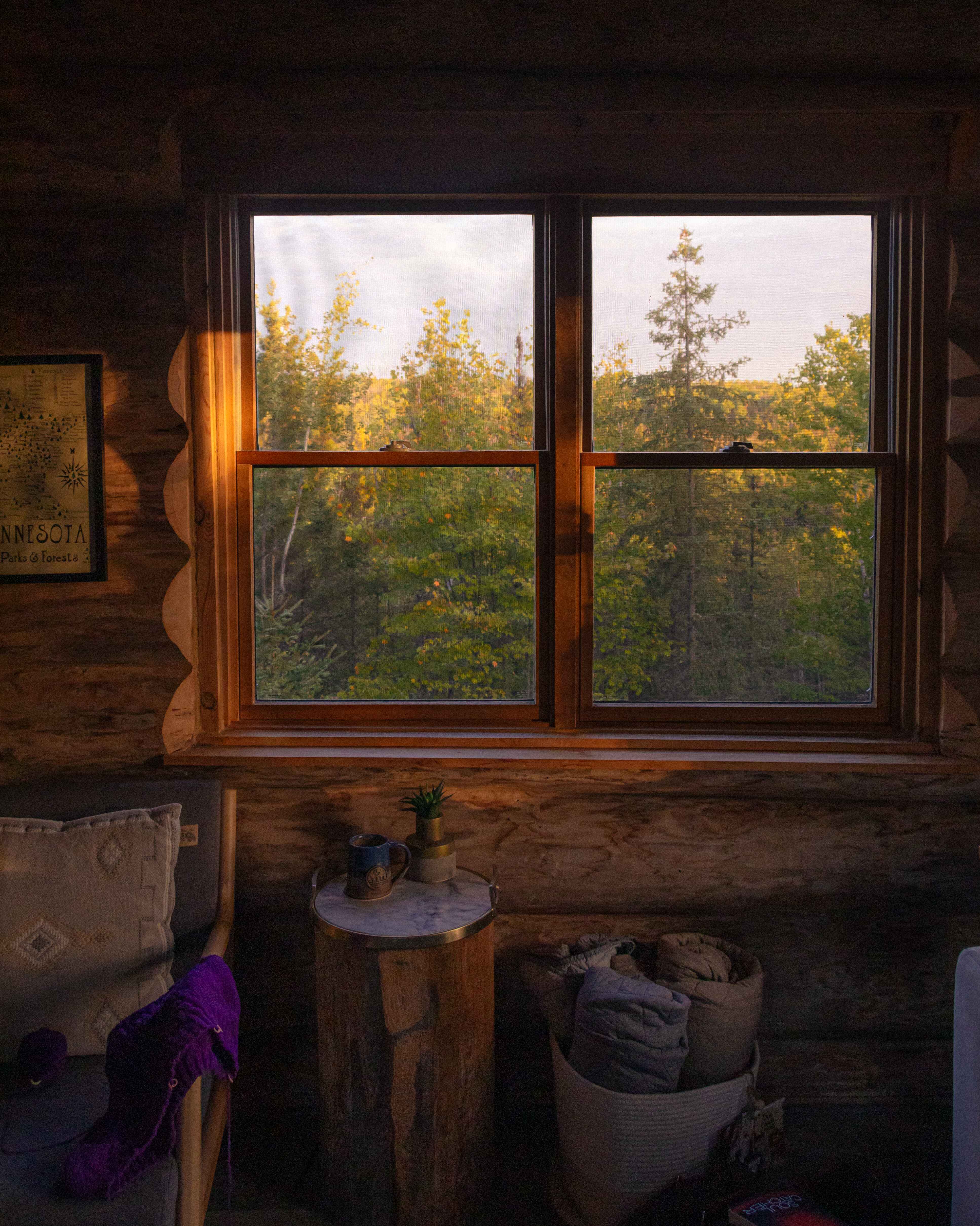 looking out the window of Ely Log Cabin in Northern Minnesota