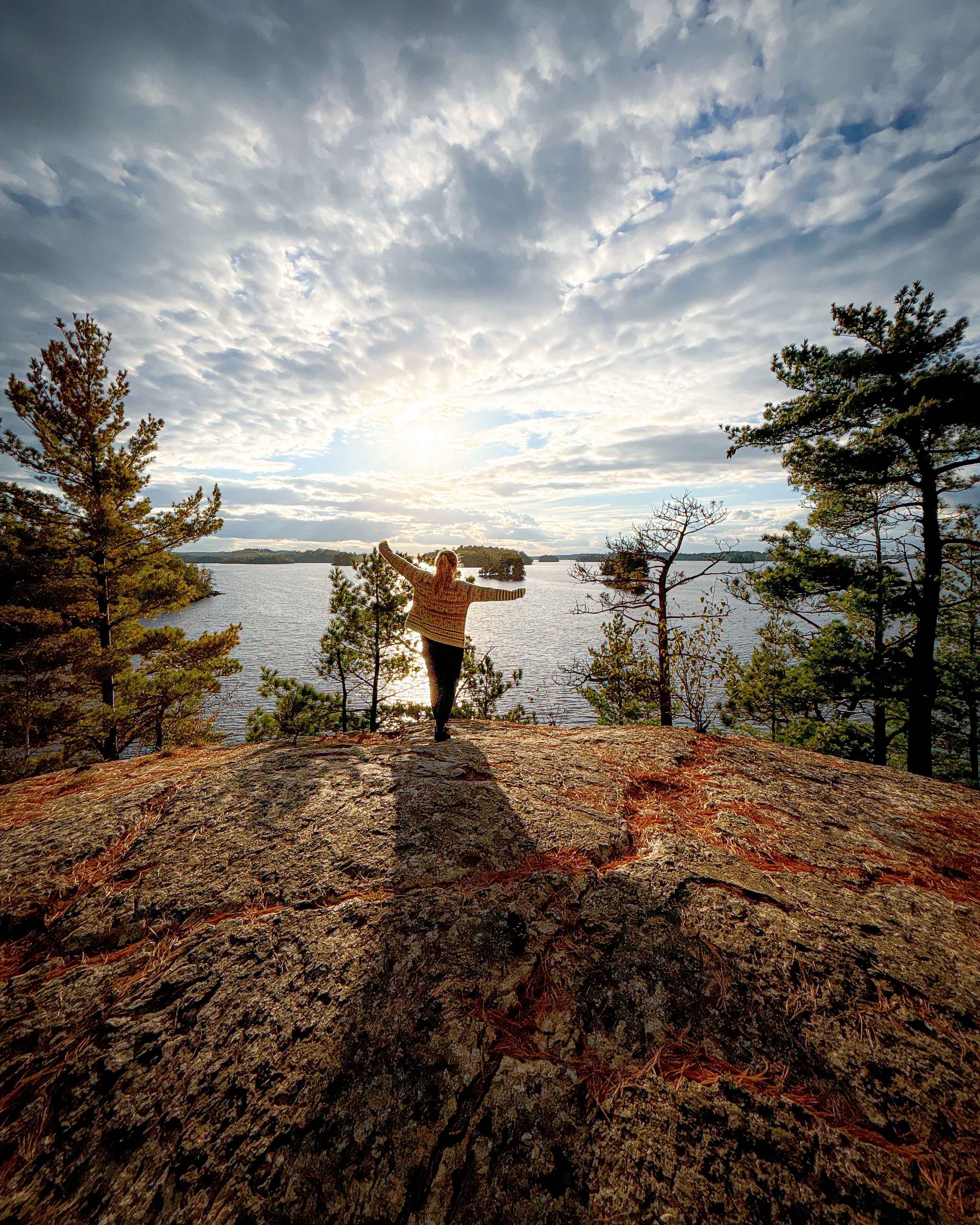 a hiker at the onamani overlook in Ely, MN, one of the best easy hikes in Minnesota for fall color