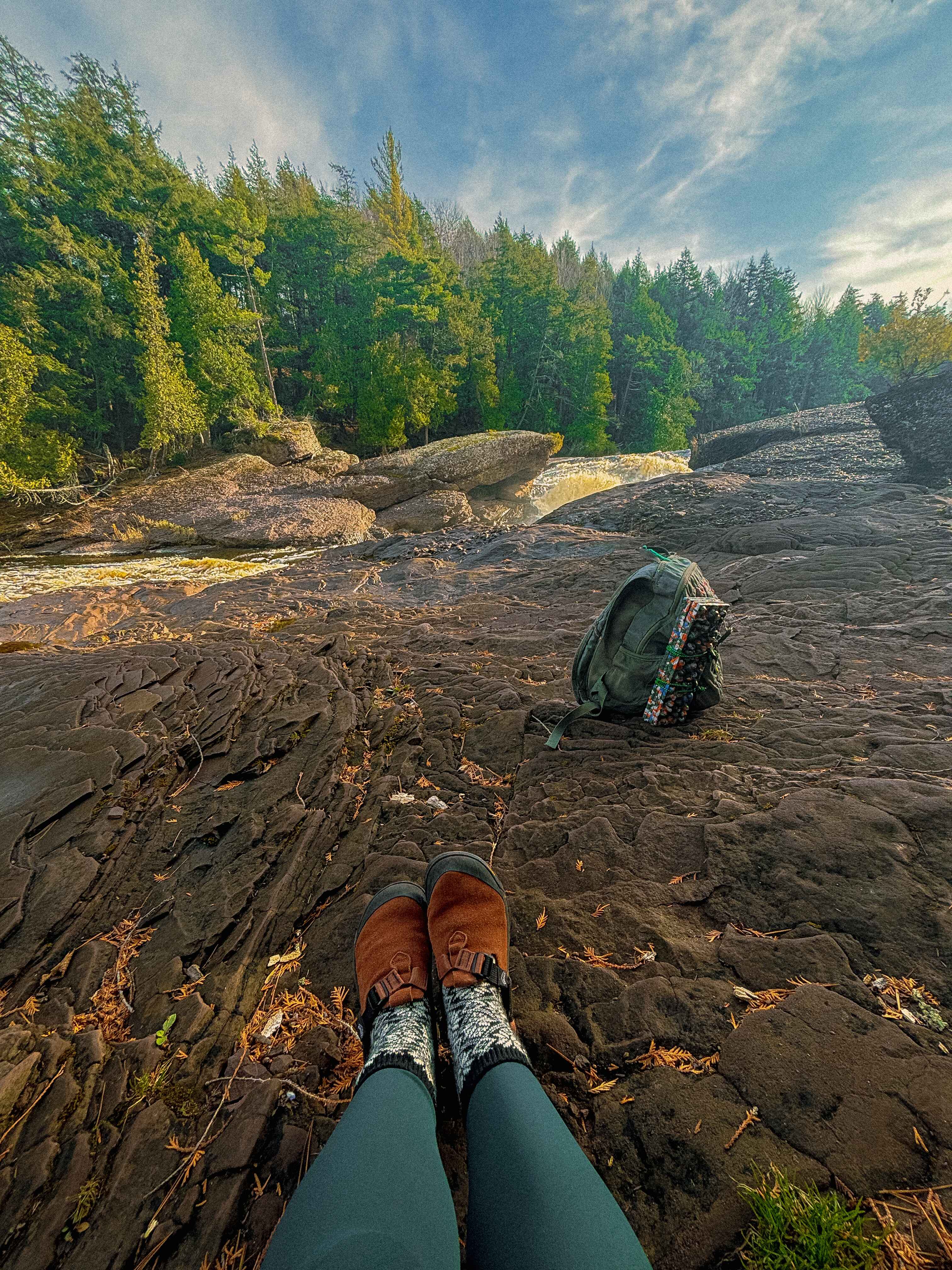 A hiking backpack by a waterfall in Ironwood Michigan 