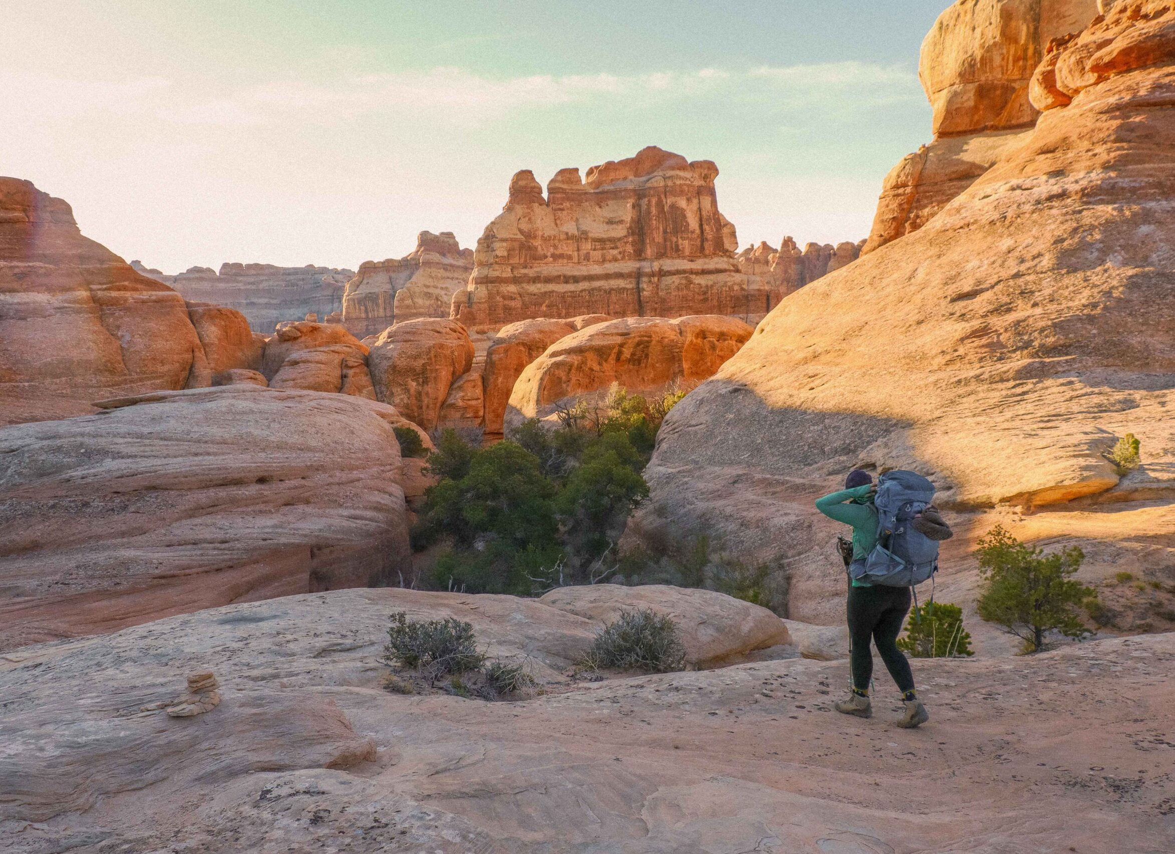 a hiker in the desert of Canyonlands National Park, Utah