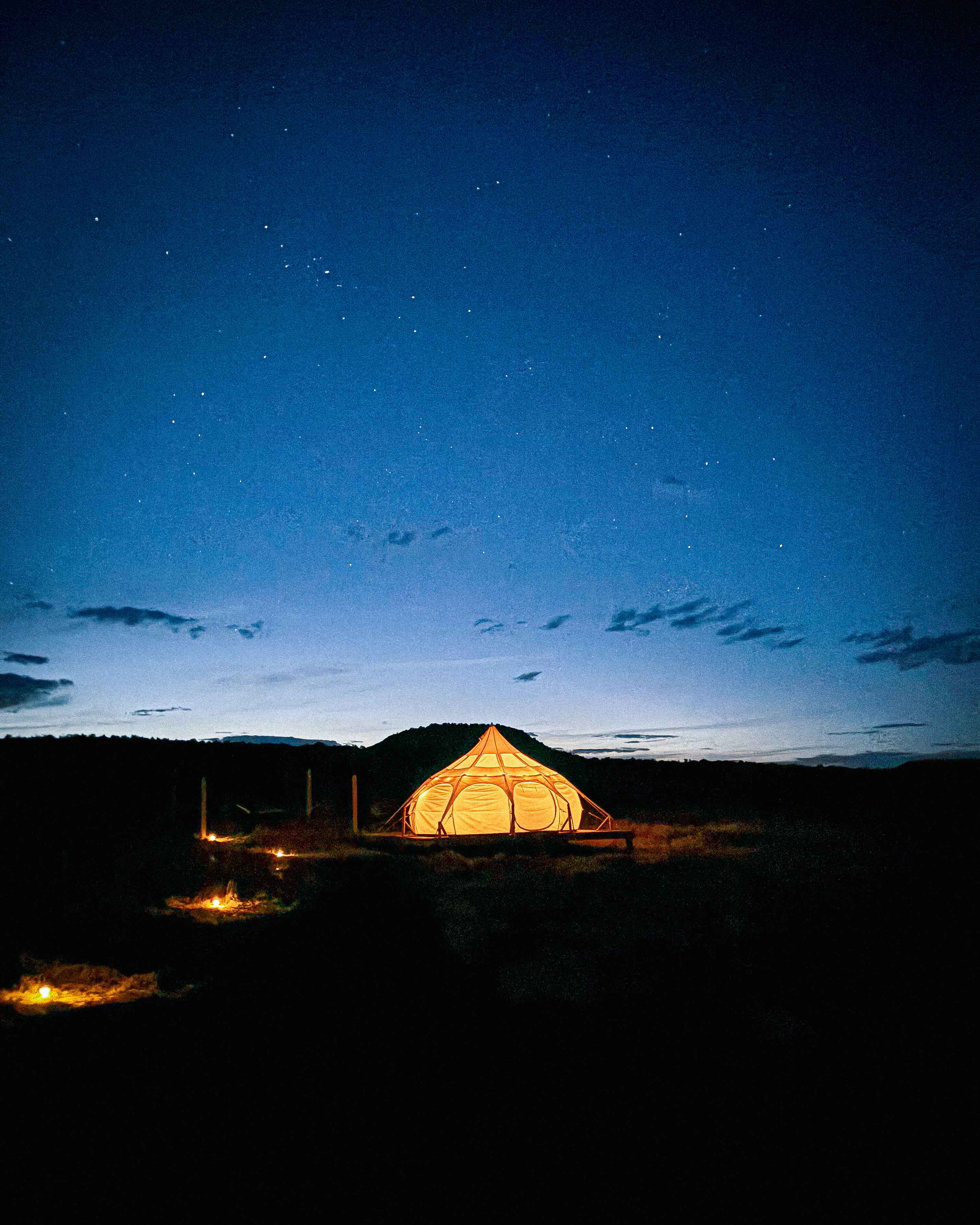 Glamping tent at glamping canyonlands lit at night