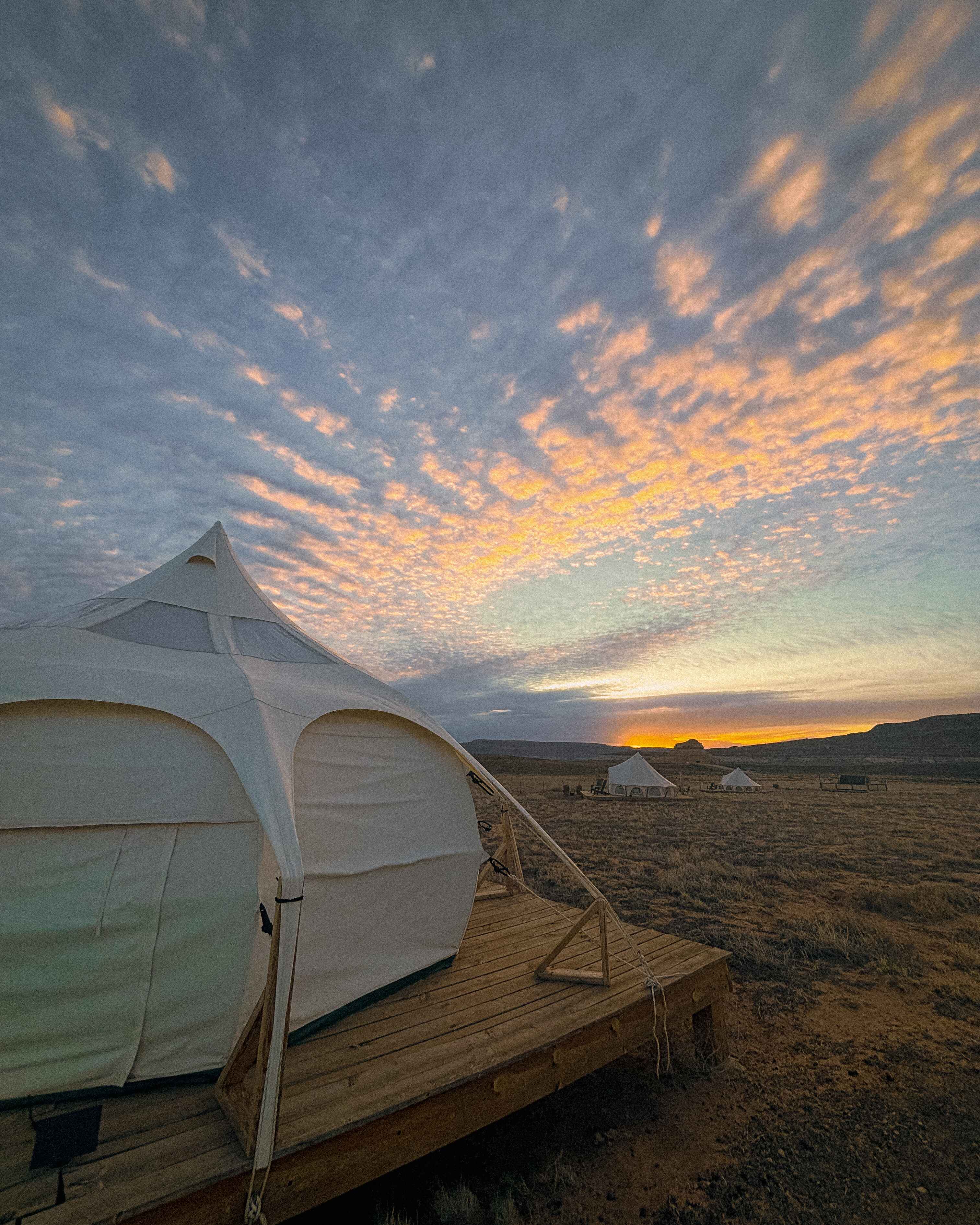 sunrise over a glamping tent outside the needles district of canyonlands national park