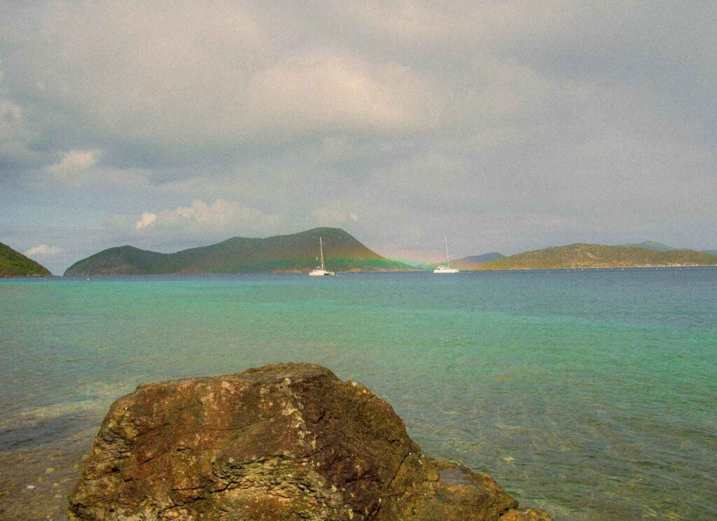 a rainbow between sailboats near Waterlemon Cay in Virgin Islands National Park