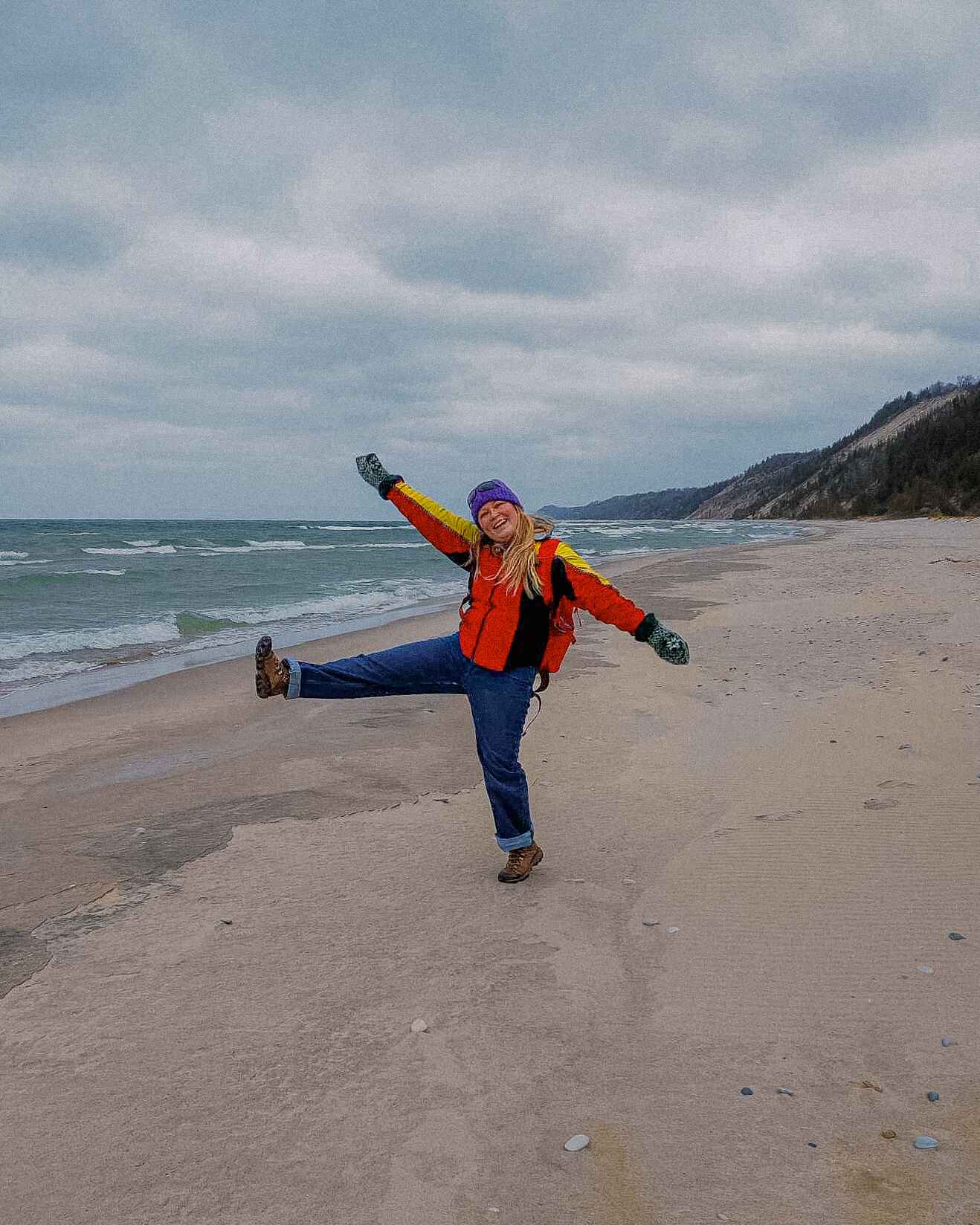 A hiker on a wintery beach near Frankfort, Michigan