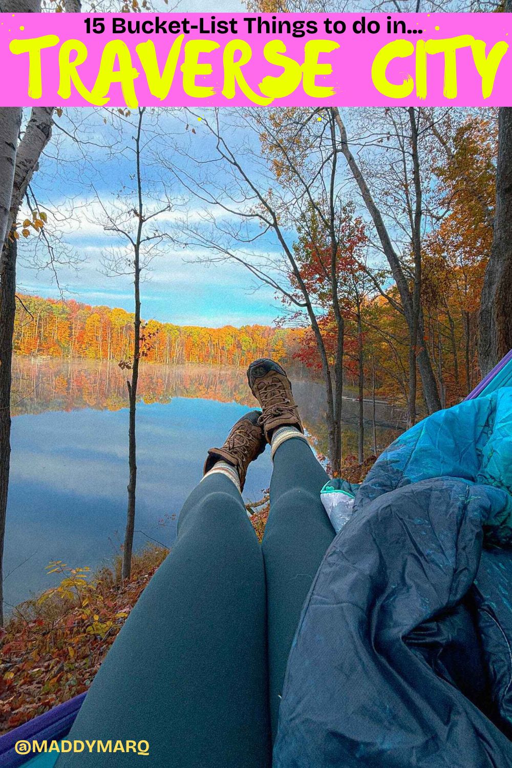 "Best things to do in Traverse City, Michigan" written over the top of an image of a hiker's feet and legs sticking out of a hammock with a blanket in it with a peaceful lake and fall colors in the background