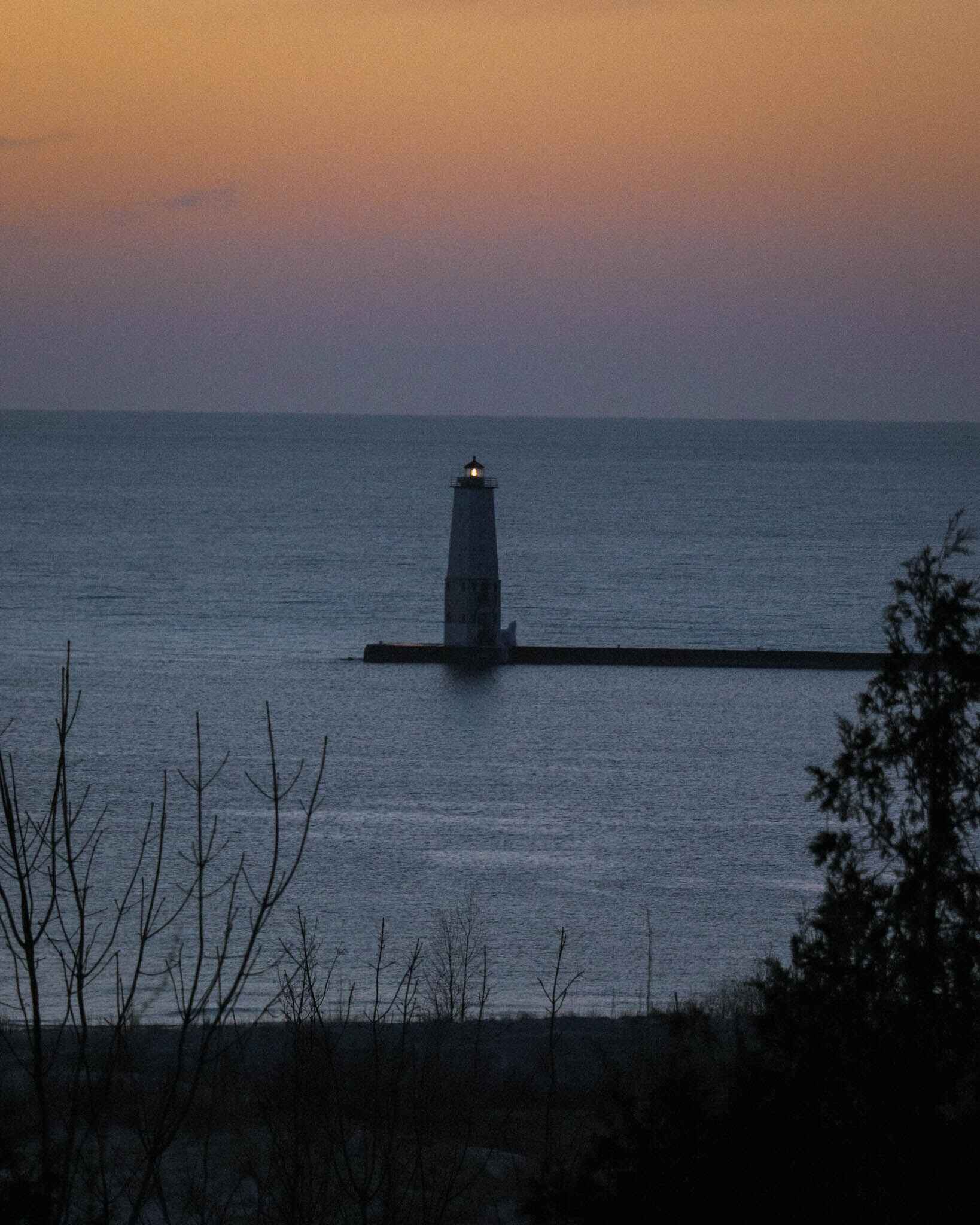 Image of the Frankfort lighthouse on Lake Michigan after sunset