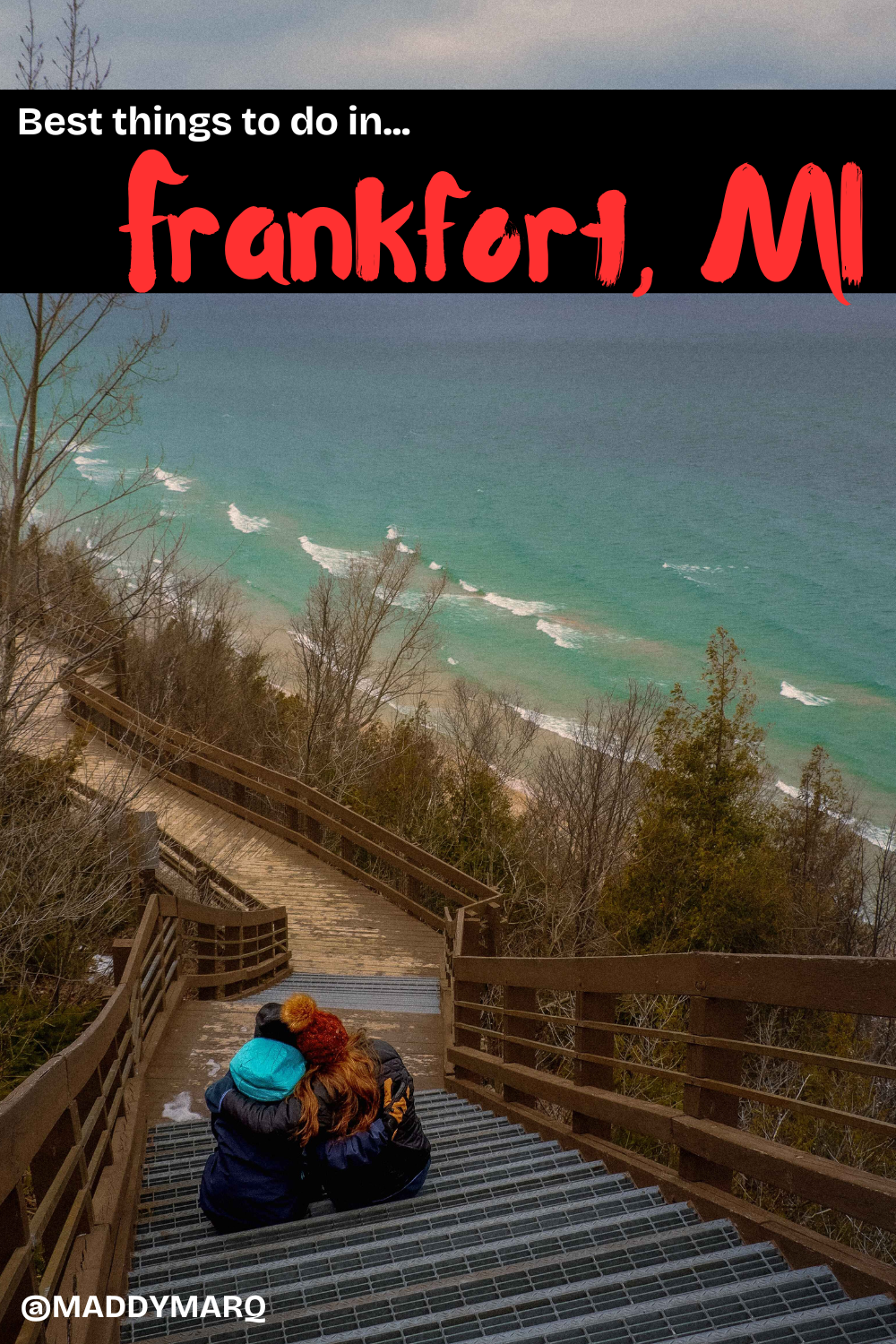 text best things to do in frankfort michigan over image of two women hugging on a set of stairs overlooking very blue lake michigan waves