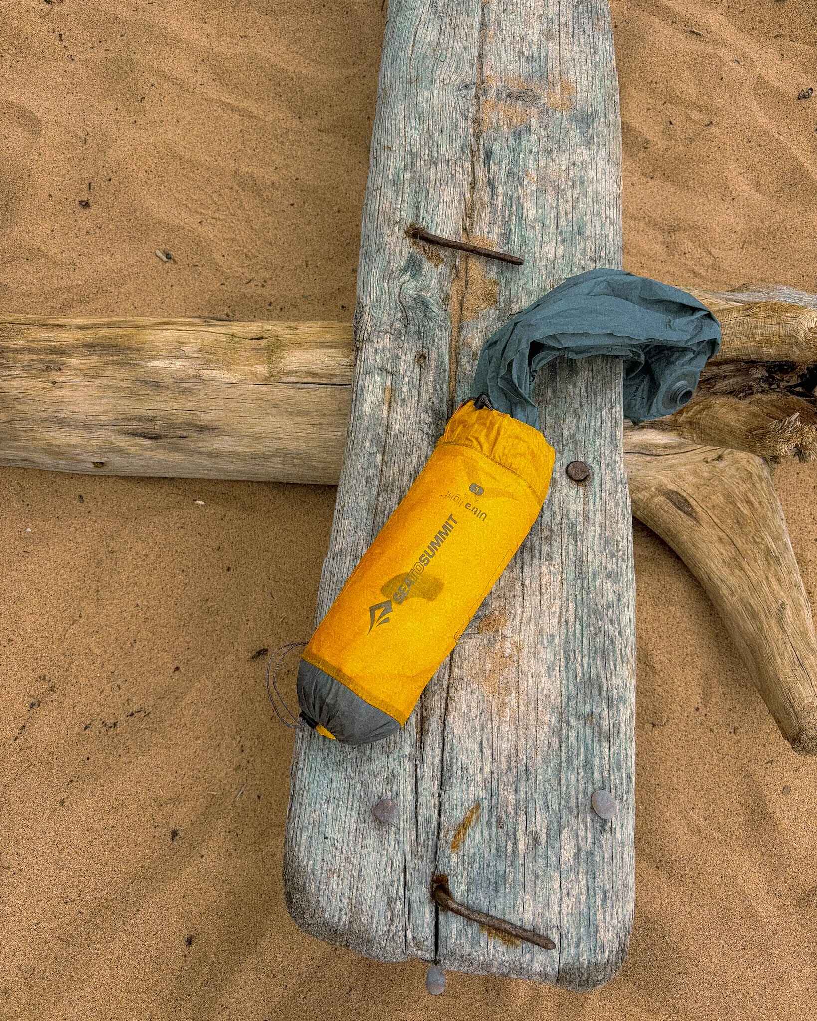 image of a sea to summit sleeping pad in the sand