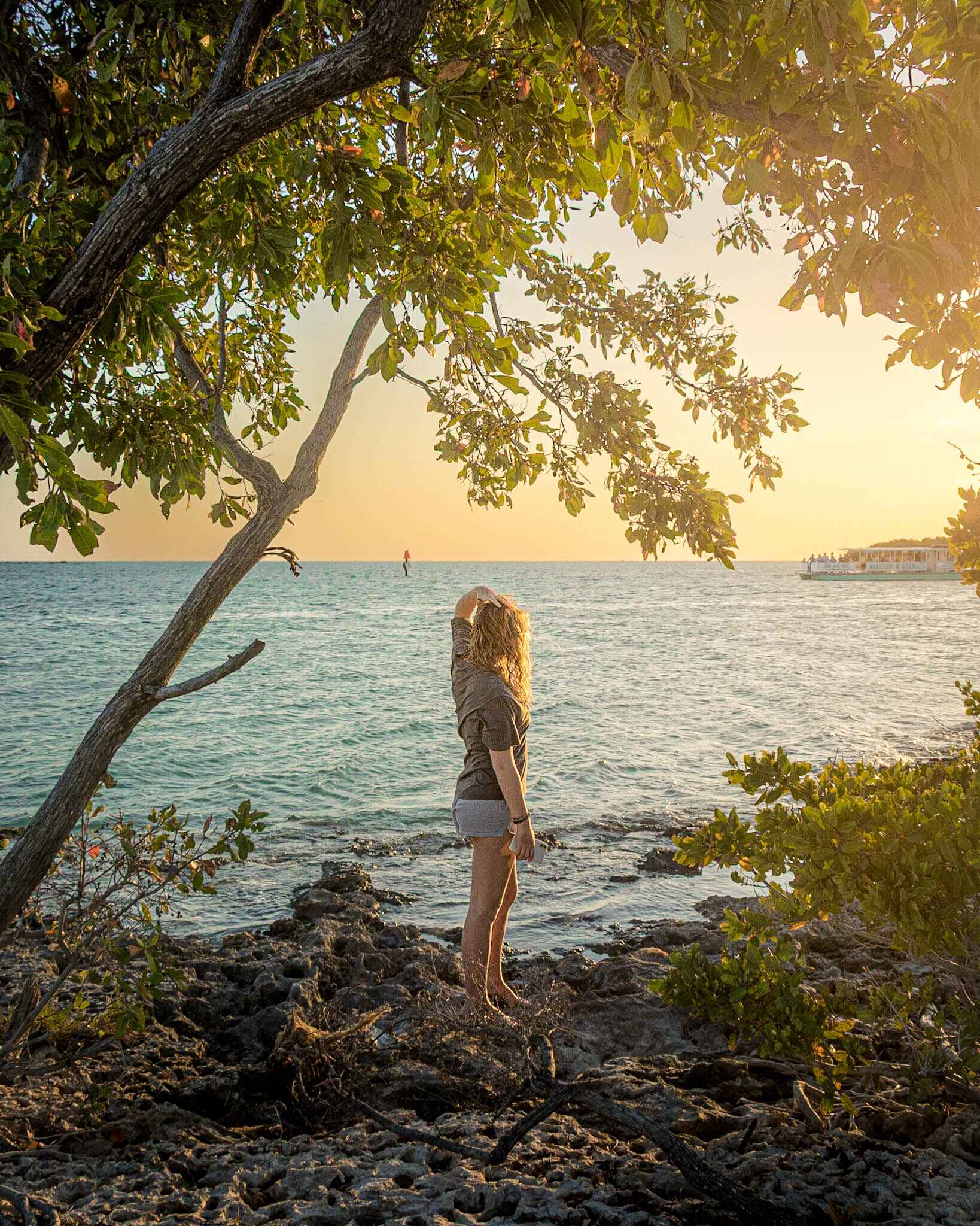 a hiker at the waters edge near marathon florida