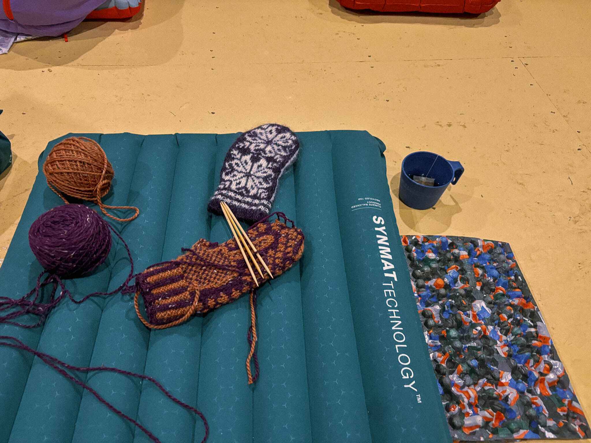 Exped Duro sleeping pad in a cabin with knitting on top 