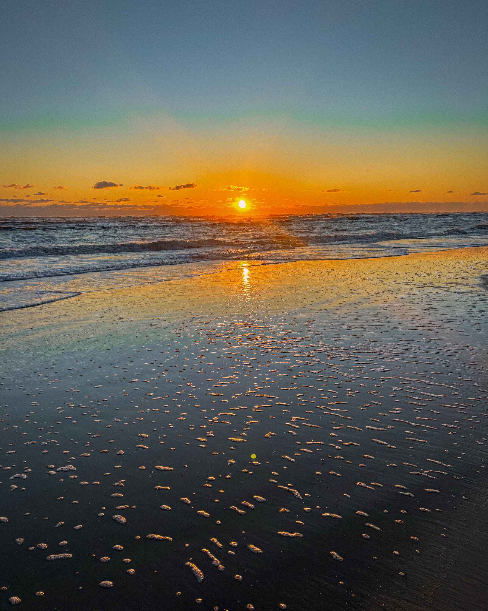 Sun rises over the Atlantic Ocean in North Carolina's Outer Banks near Nags Head