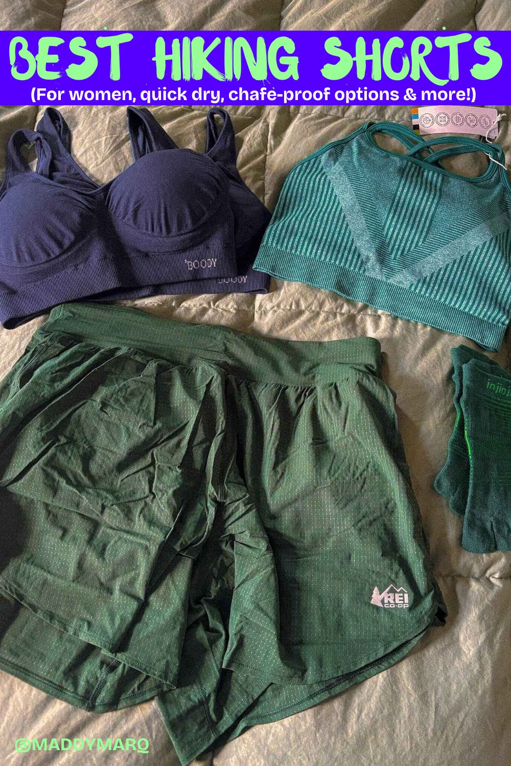 text best hiking shorts for women quick dry chafe proof over image of a pair of hiking shorts and sports bras flat lay on a bed