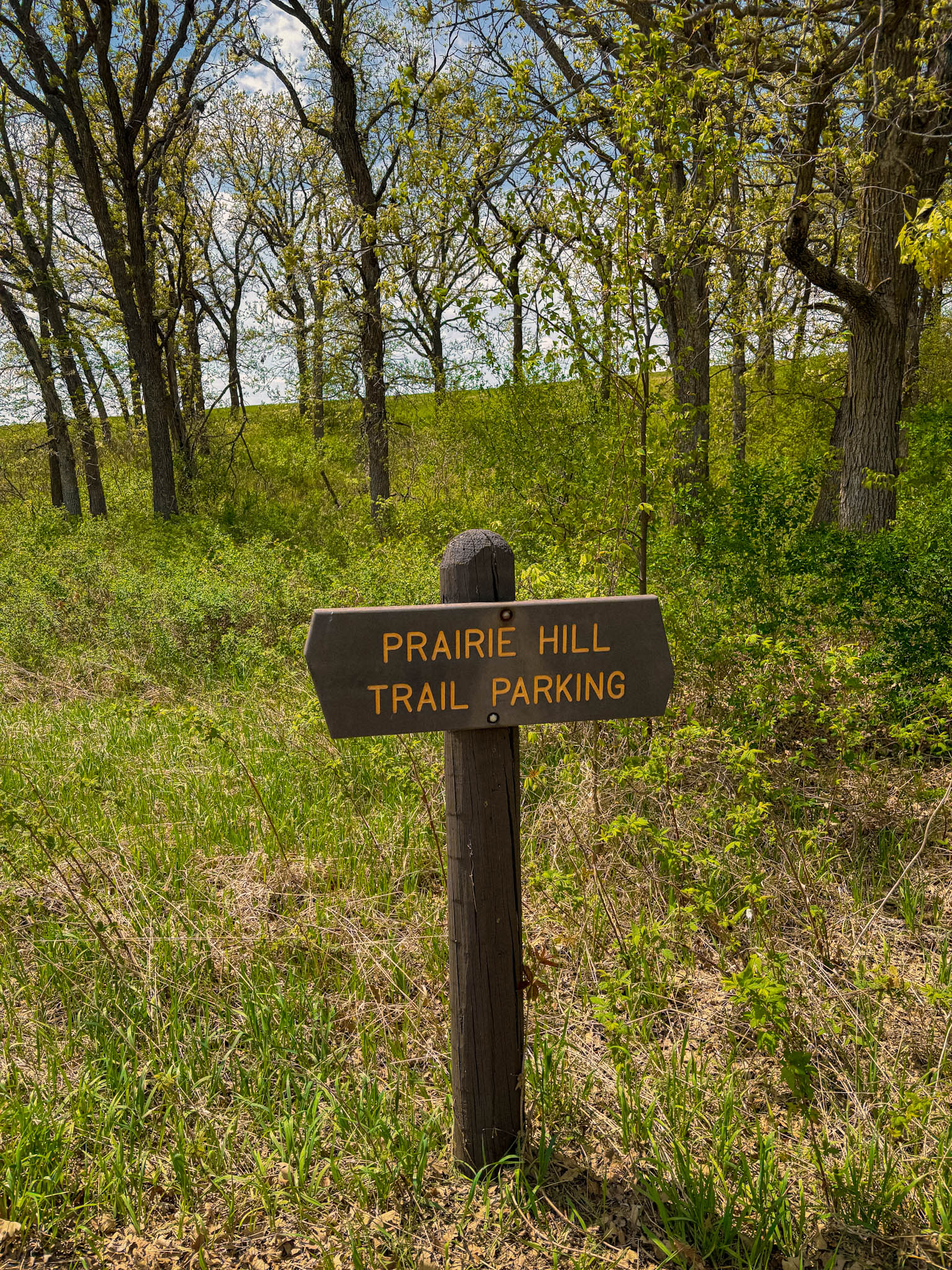 park sign reads "prairie hill trail parking" in Glendalough State Park, Battle Lake Minnesota
