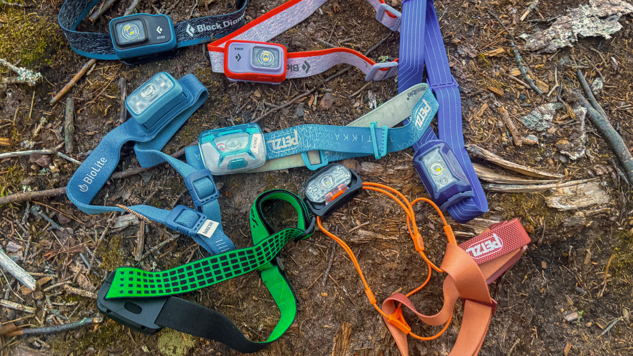 image of headlamps scattered in the dirt