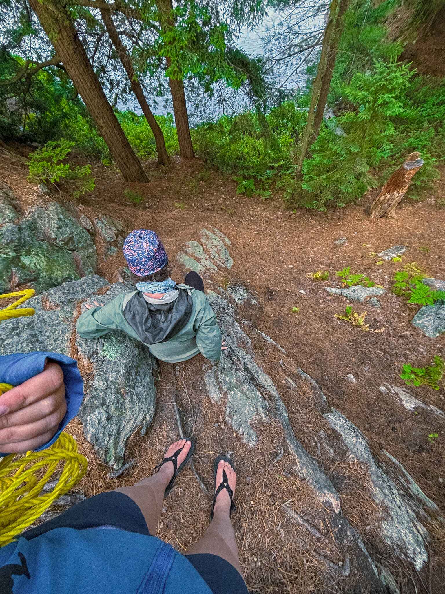 Hiker scales a tricky section of rail at a campsite in Killarney Provincial Park in the La Cloche Mountains