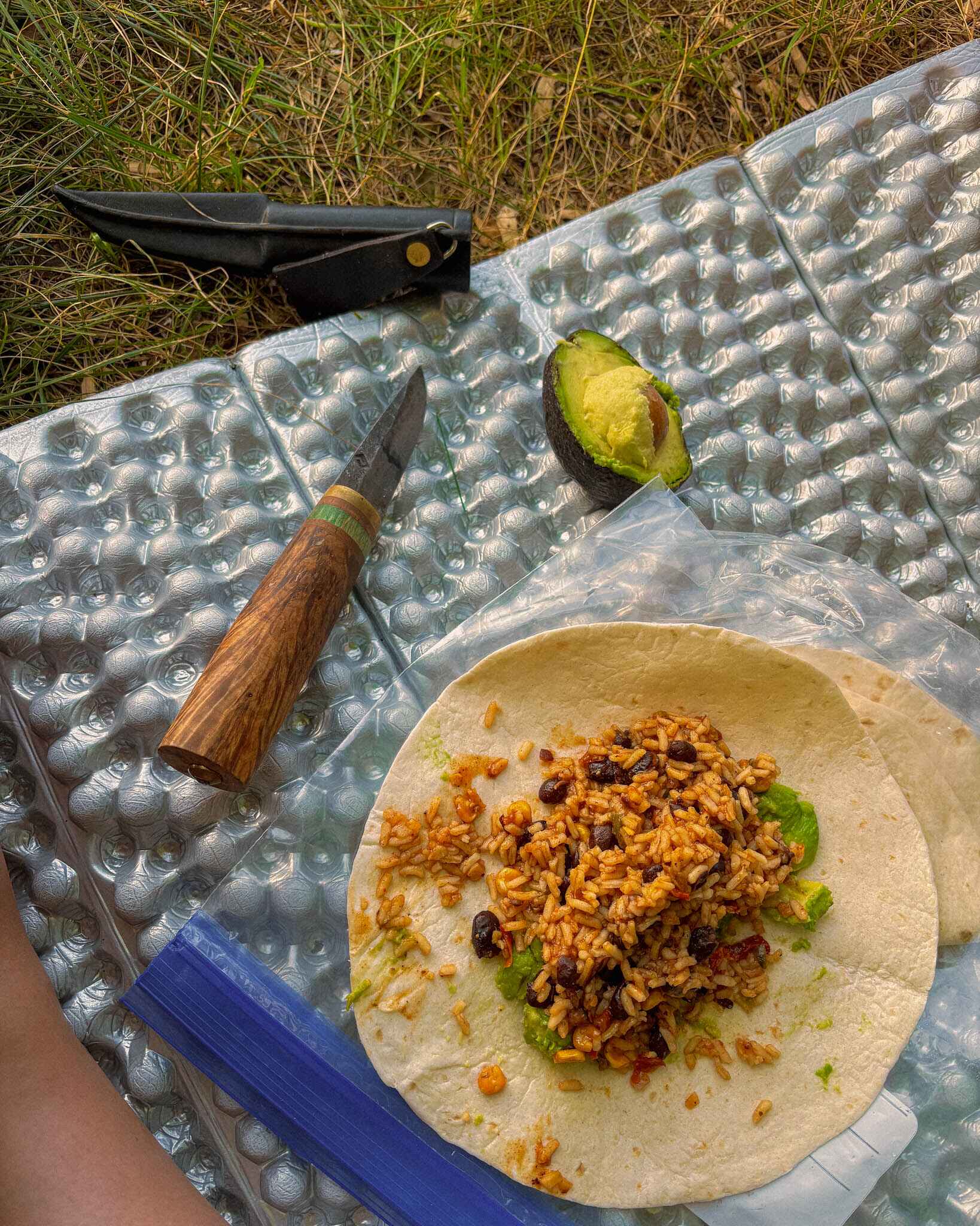 backpacking beans and rice repurposed into a burrito with toritlla and avocado