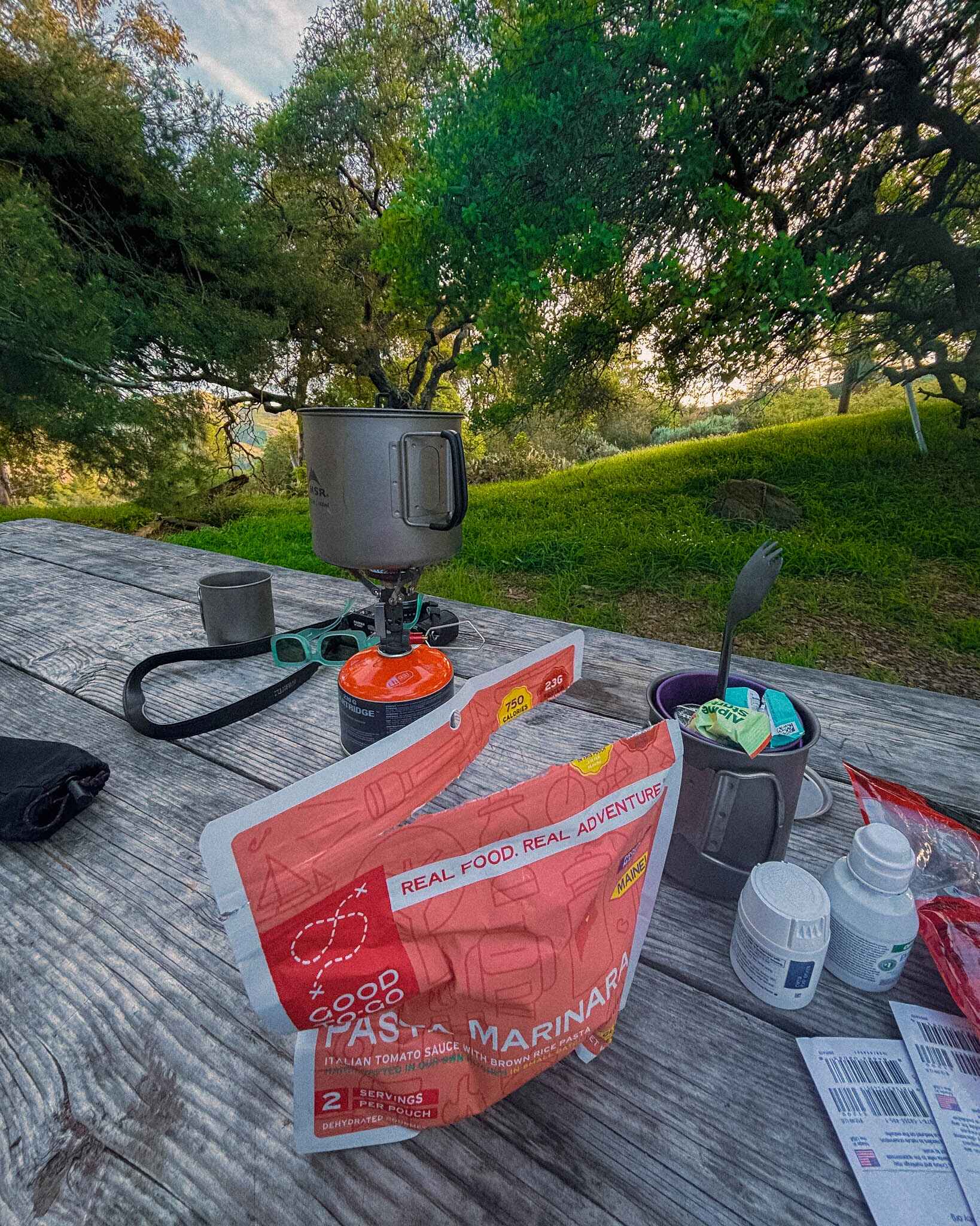 A camp cook setup on a picnic table on the trans catalina trail