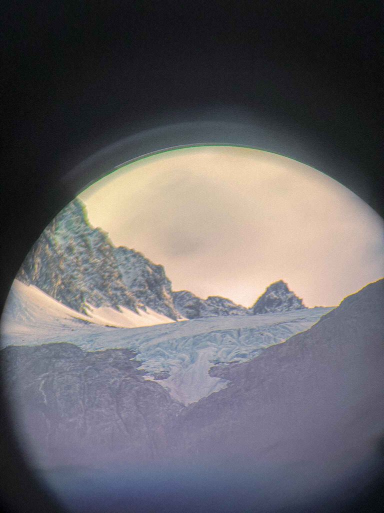 Image of a glacier viewed through binoculars