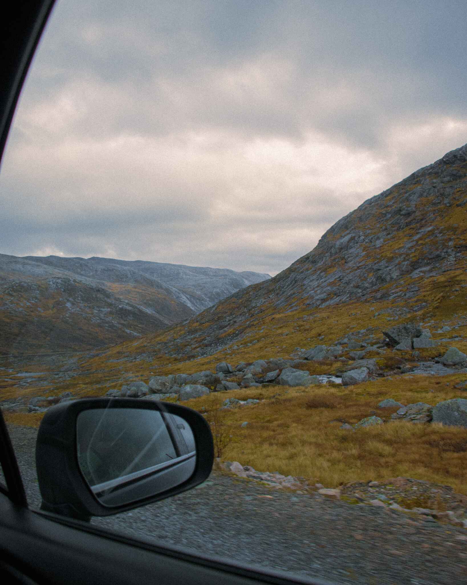 image looking out a car window over norway's landscapes