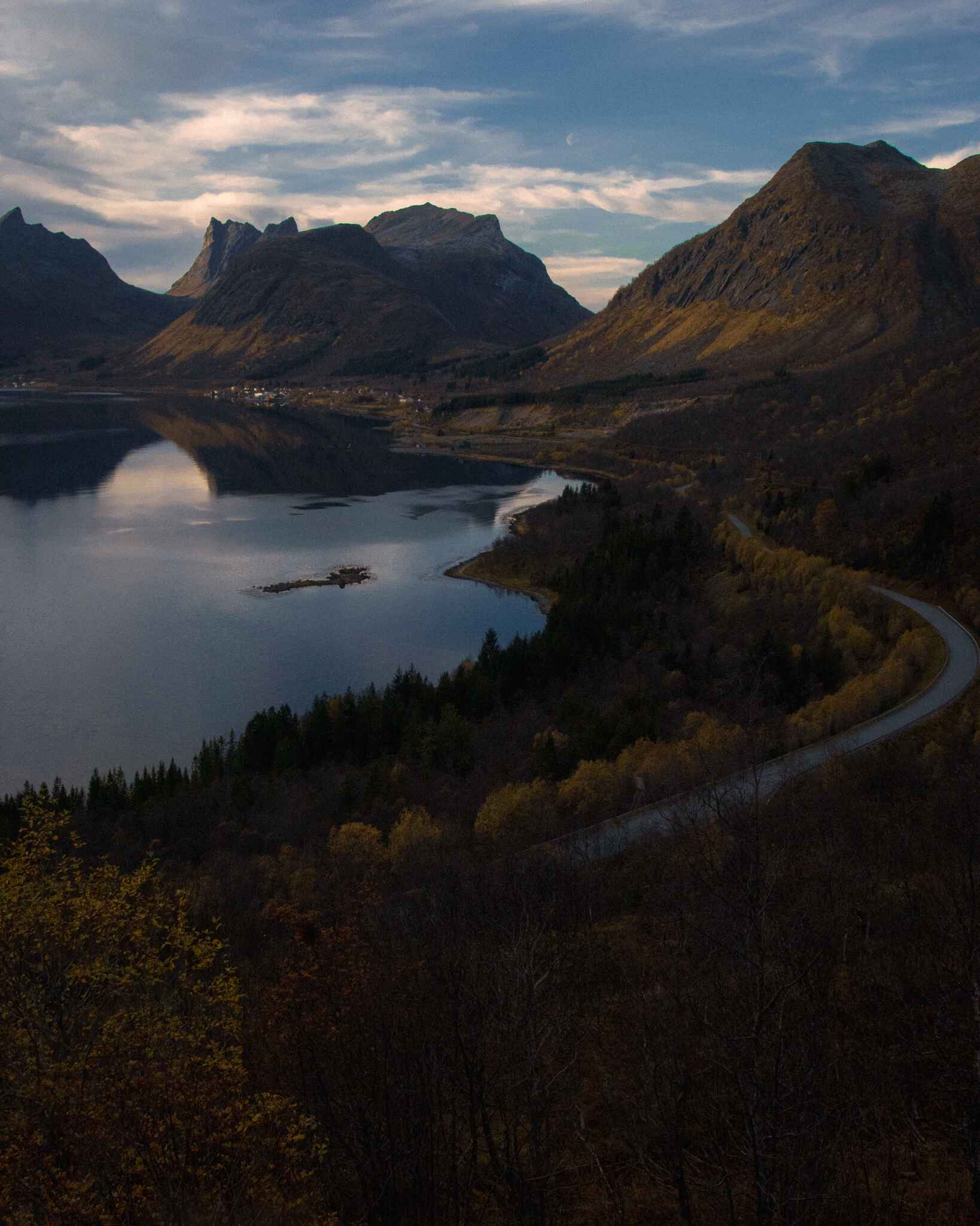 image of a winding road along mountains and the ocean