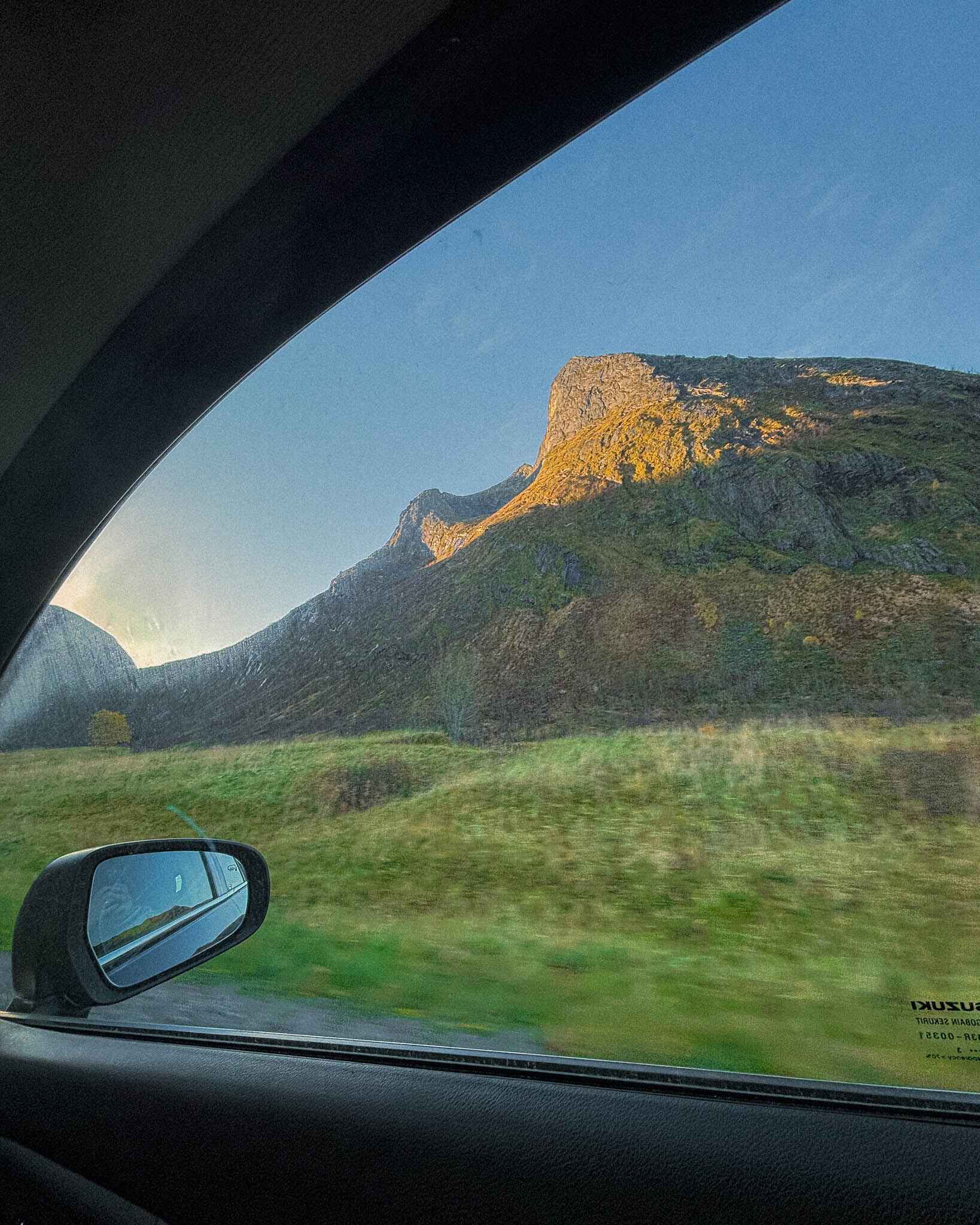 Image of a mountain looking out a car window